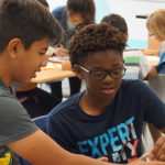 Two students working together in classroom